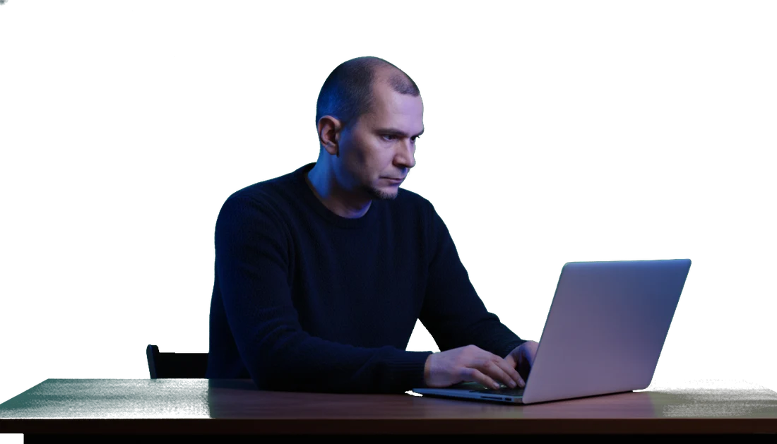 Andrei at the laptop, deep in a problem.